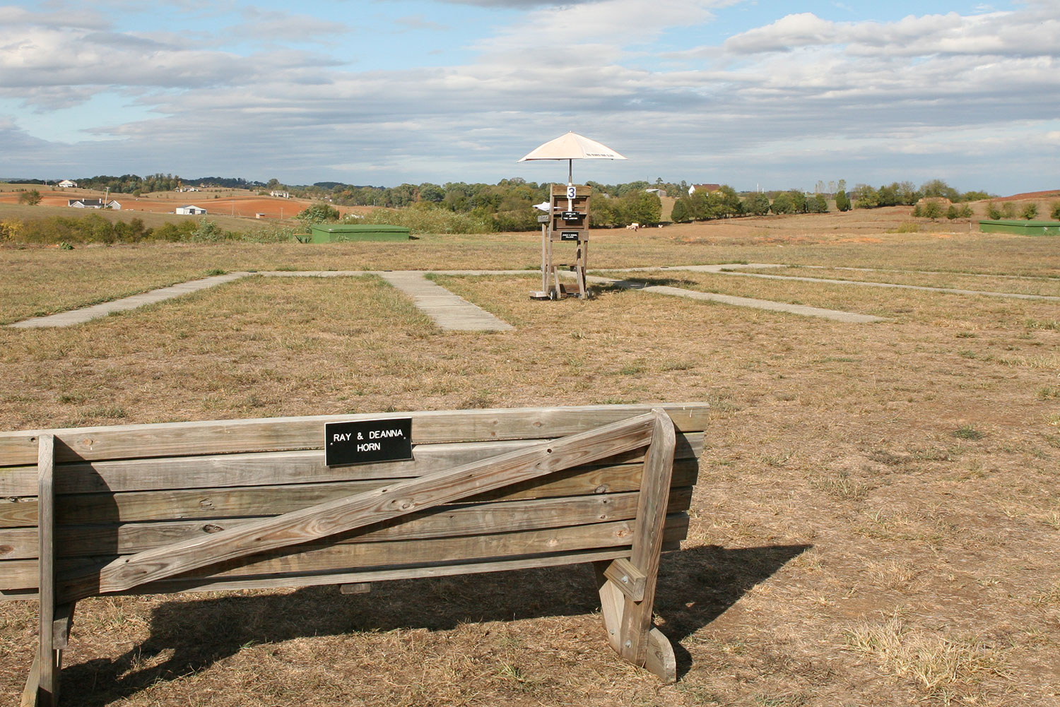Wooden bench in front of a trap house